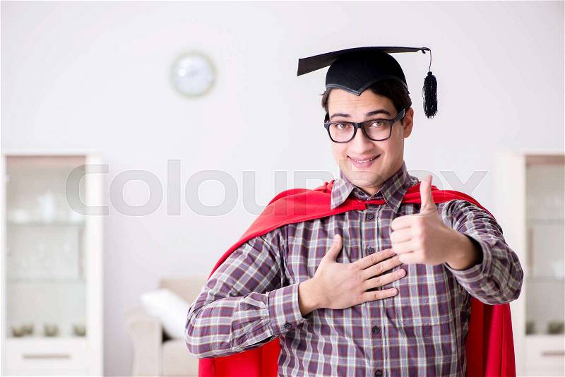 Super hero student wearing mortarboard in a red cloak, stock photo