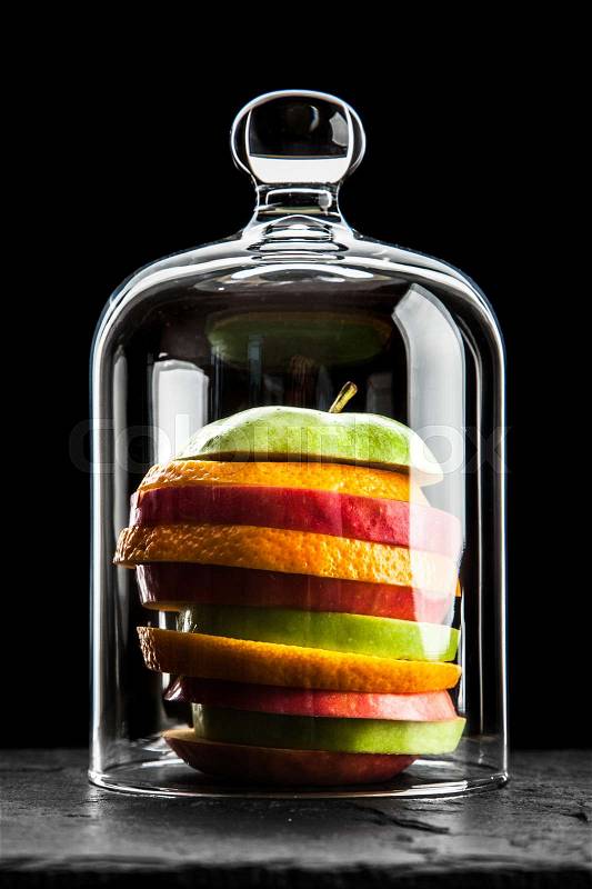 Colorful fresh fruit slices on black background, stock photo