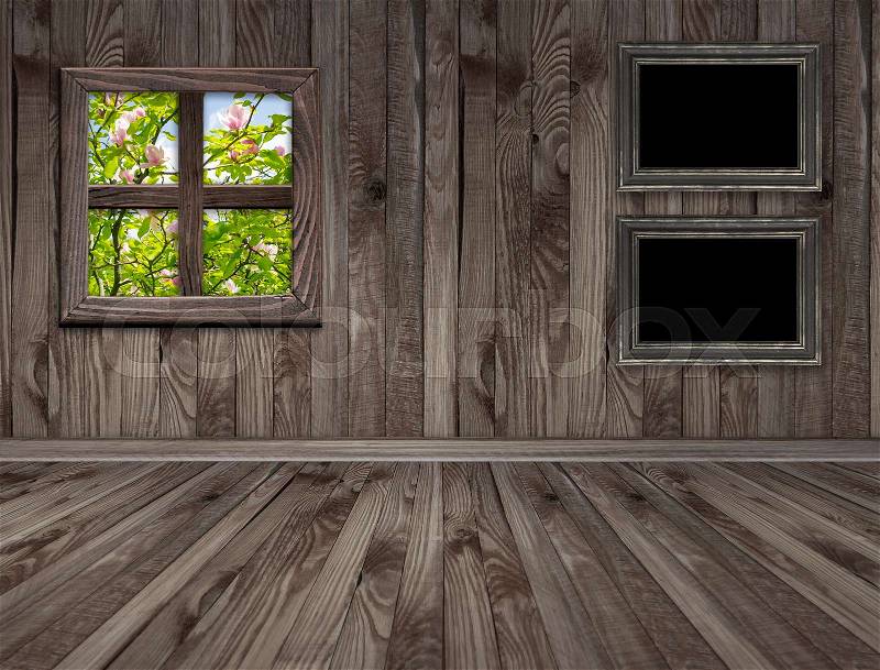 Empty room interior with frames and magnolia tree outside the window. Copy space, stock photo