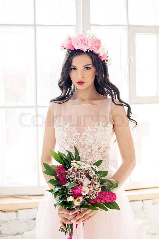 Beautiful Woman Fashion Model with Bridal Hairstyle, Natural Makeup and Flowers, stock photo