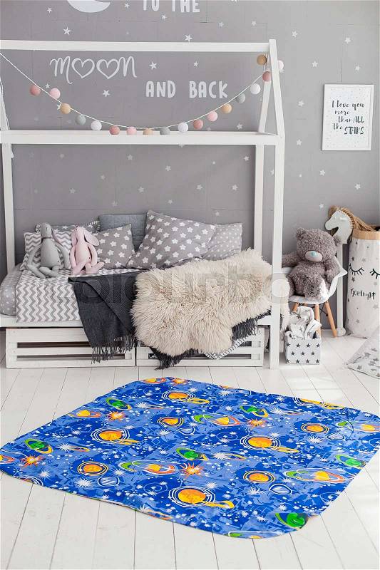 Modern interior of the child's bedroom with carpet in front. Loft grey style, stock photo