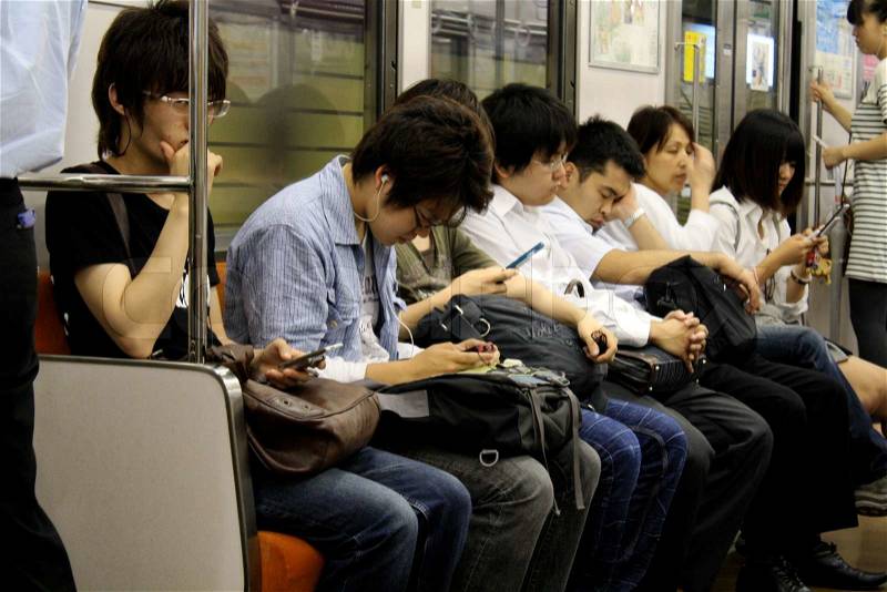Japanese people in a train on sina way home from work, stock photo