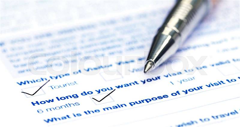 Visa application form with a ballpoint, stock photo