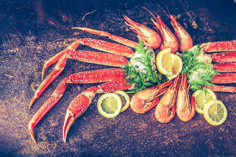 Seafood. Crab Legs. crab legs with fresh lemon, stock photo