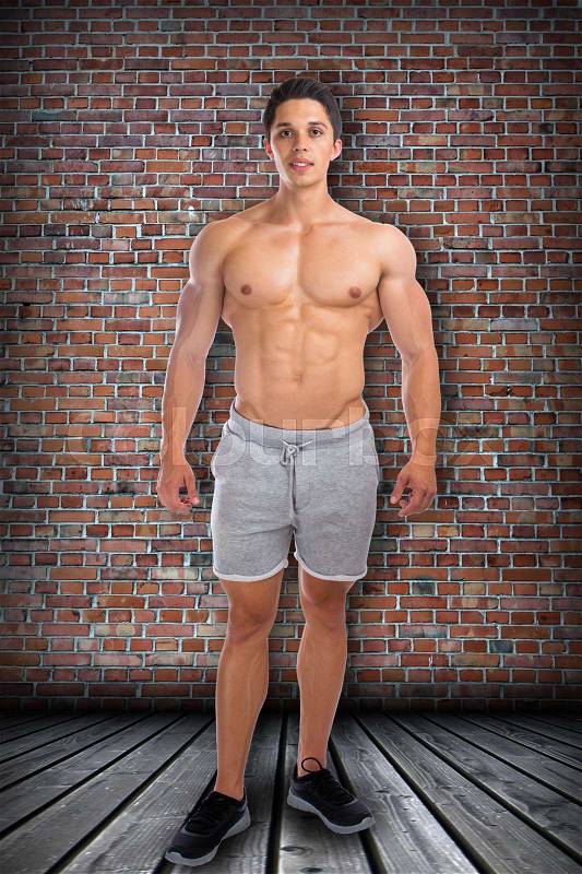 Bodybuilder bodybuilding muscles standing whole body portrait muscular man sixpack, stock photo