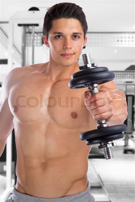 Training bodybuilder bodybuilding muscles gym power strong muscular young man dumbbell fitness studio, stock photo