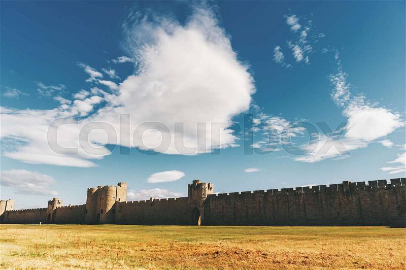 Famous fortification wall surrounding Aigues-Mortes city, Camargue, France, stock photo