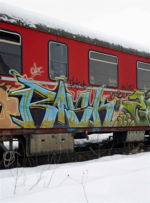 Outdoor shot of a old tagged railway car in Southern Germany at winter time, stock photo