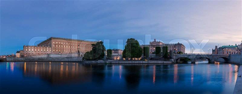 Panorama over Stockholm royal castle and parliament right after sunset with dark blue sky, stock photo