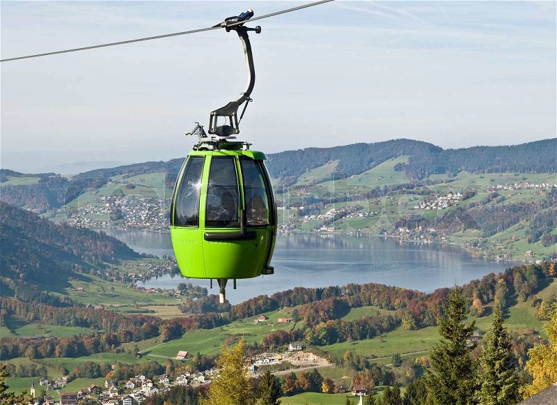 Cable car above autumn forest, stock photo