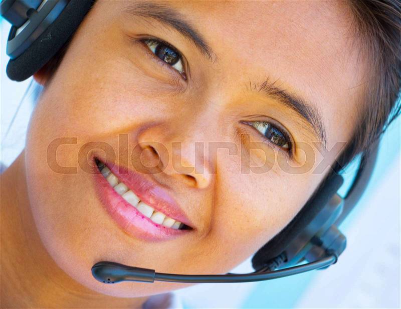 Smiling Helpdesk Operator Girl Showing Call Center Assistance, stock photo