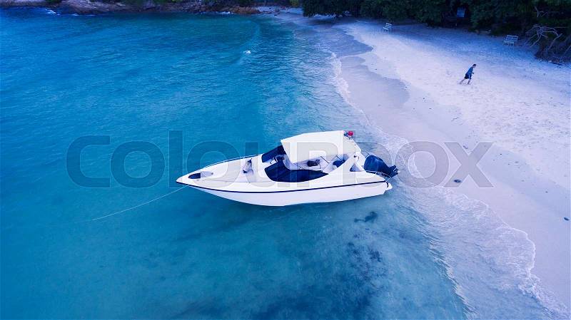 Beautiful beach with sand, blue sky, sea, ocean water with boat sunny summer outdoor as natural background, stock photo