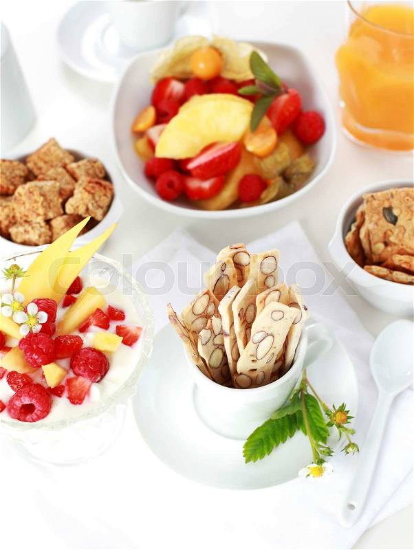 Healthy breakfast with yogurt, fresh fruits and cereal sticks, stock photo