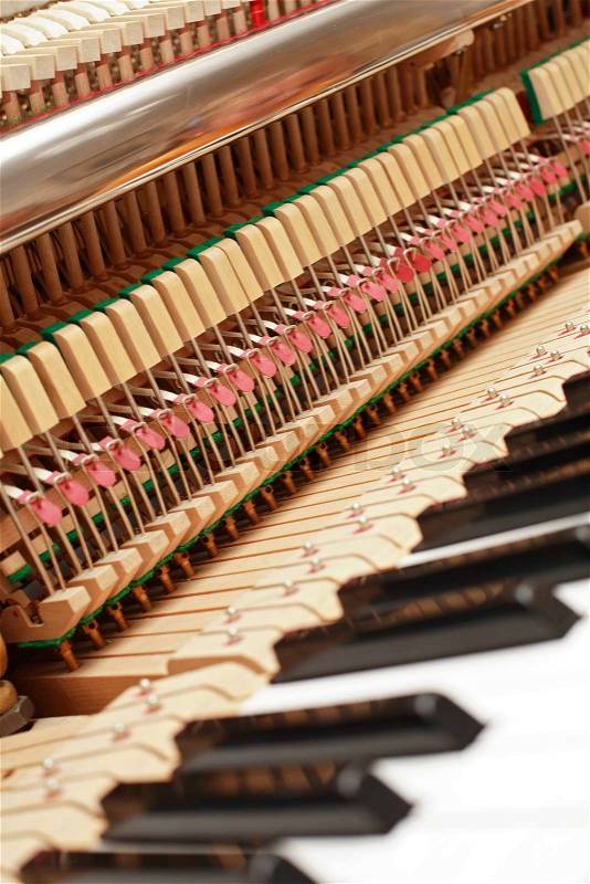 Detail of open piano with strings, stock photo