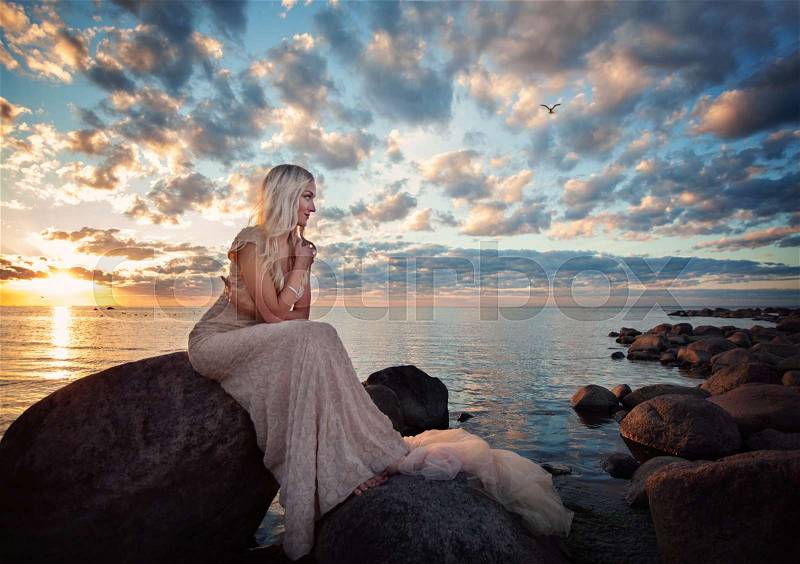 Beautiful Woman Fashion Model on Sea. Outdoors Portrait of Cute Blonde Girl, stock photo