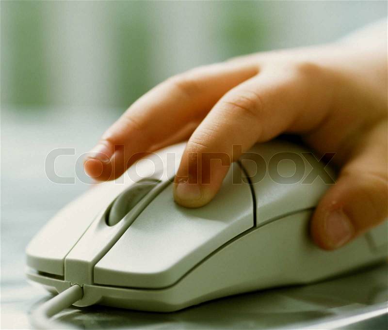 Child operating mouse close up and isolated, stock photo