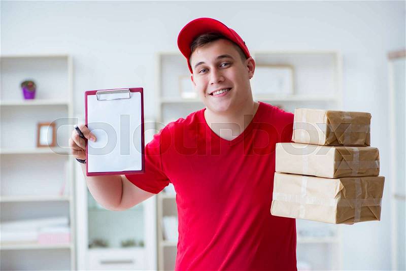 Post man delivering a parcel package, stock photo