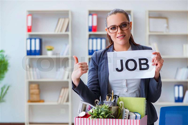 Businesswoman quitting her job in office, stock photo
