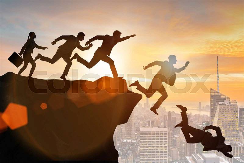 Business people falling off the cliff, stock photo