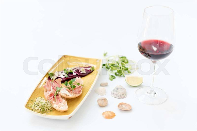 Bruschetta with Parma Ham and wine. Microgreens on roasted red beets and feta cheese. Micro greens, diet and healthy food, stock photo