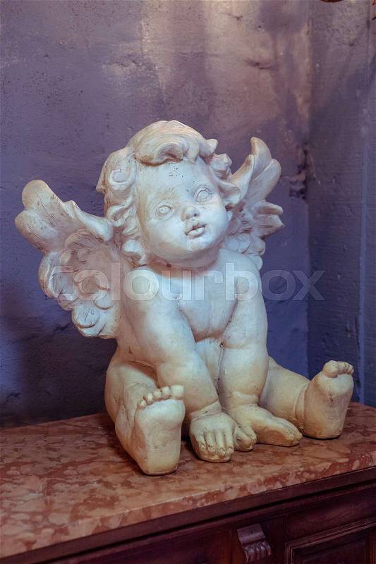 Cupid statue white in the room, stock photo