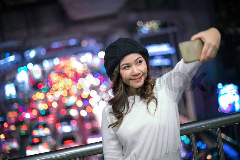 Happy asian woman taking selfie joyful and happy smiling, stock photo