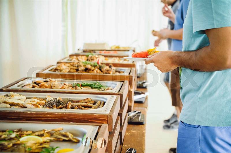 Outdoor Cuisine Culinary Buffet Dinner Catering. Group of people in all you can eat. Dining Food Celebration Party Concept. Service at business meeting, weddings. Selective focus, stock photo