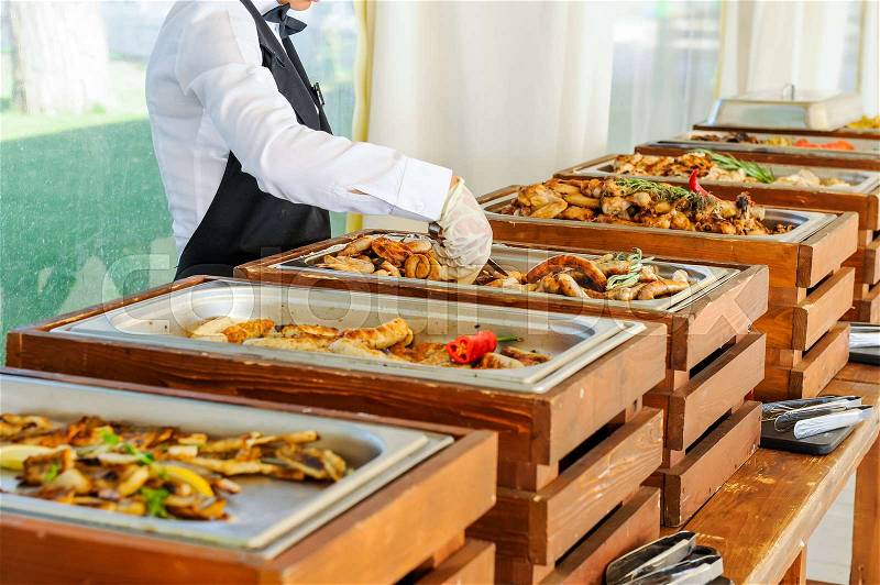 Outdoor Cuisine Culinary Buffet Dinner Catering. Group of people in all you can eat. Dining Food Celebration Party Concept. Service at business meeting, weddings. Selective focus, stock photo