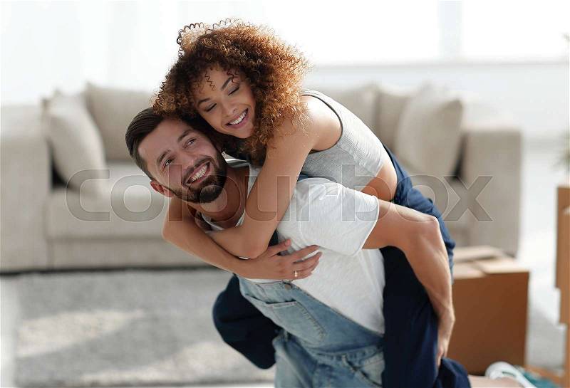 Wife and husband are happy to move to a new apartment. Family and real estate, stock photo