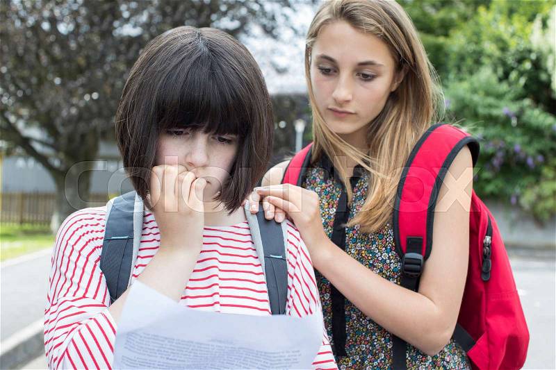 Teenage Girl Consoles Friend Over Bad Exam Result, stock photo