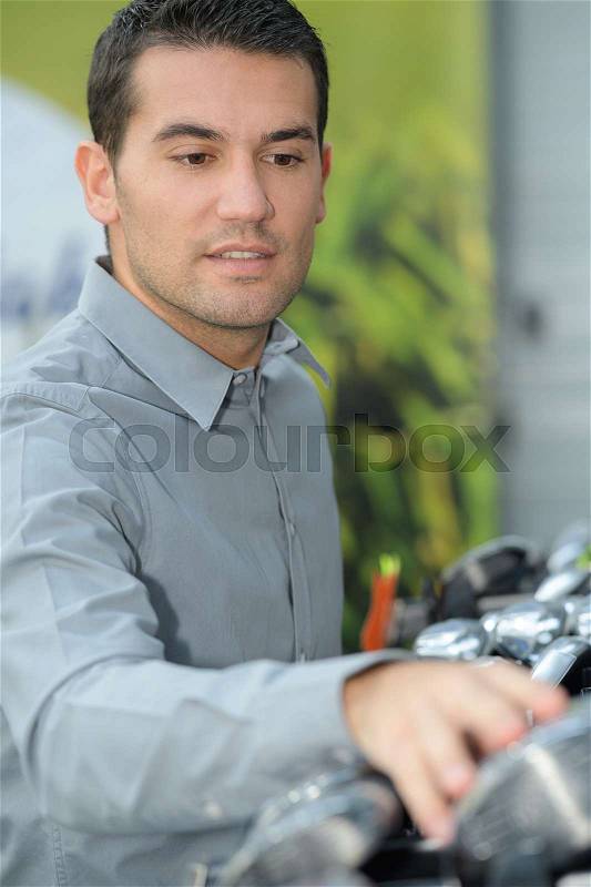 Factory man counting manufacturing workpiece, stock photo
