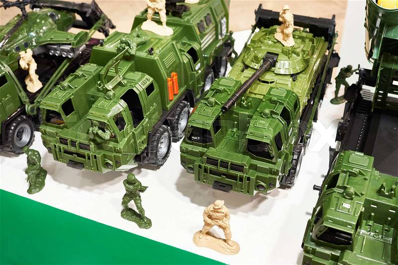 Toy military equipment, vehicles, weapons, and soldiers, stock photo
