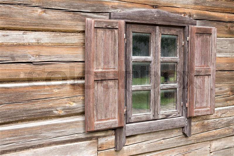 Wooden log house,window with open shutters, stock photo