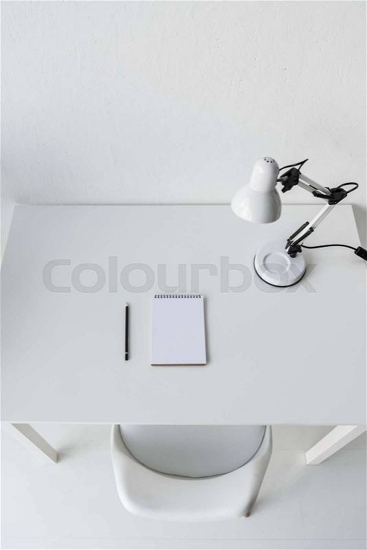 Top view of stylish white workplace with blank notebook, stock photo