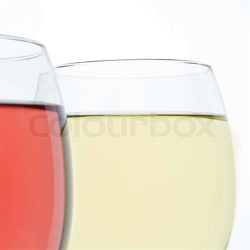 Two wine glasses with white and rose wine, stock photo