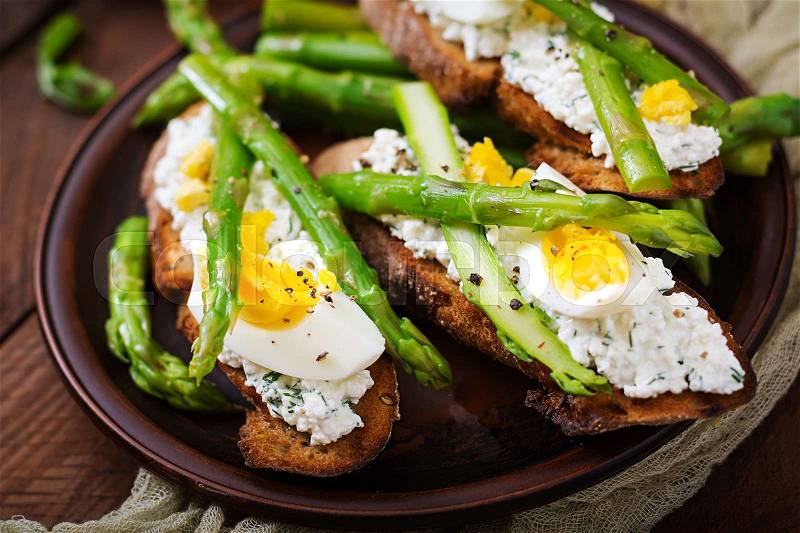 Sandwiches with asparagus, cottage cheese, pepper and eggs, stock photo