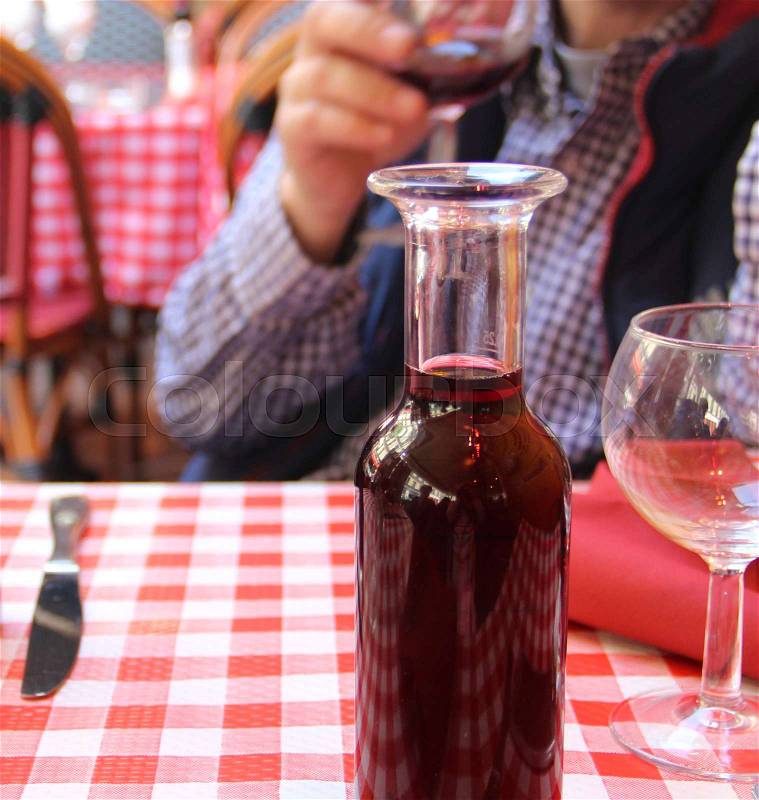 Home wine in the jar in French restaurant, detail, stock photo