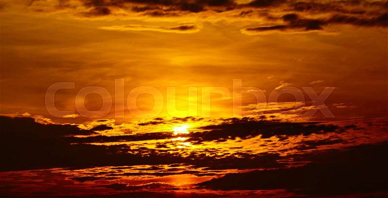 Colorful dramatic sky with cloud at sunset. Golden sky background, stock photo