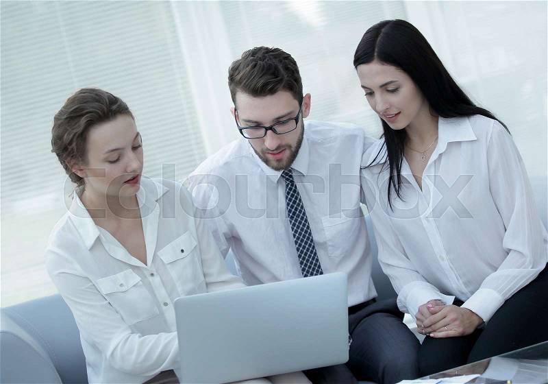 Business team discussing information with laptop in office. photo with copy space, stock photo