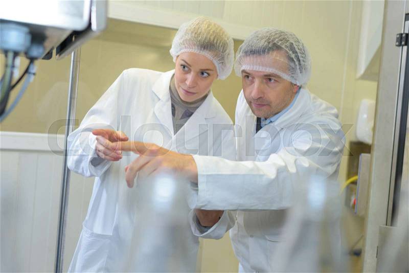 Two factory workers, stock photo