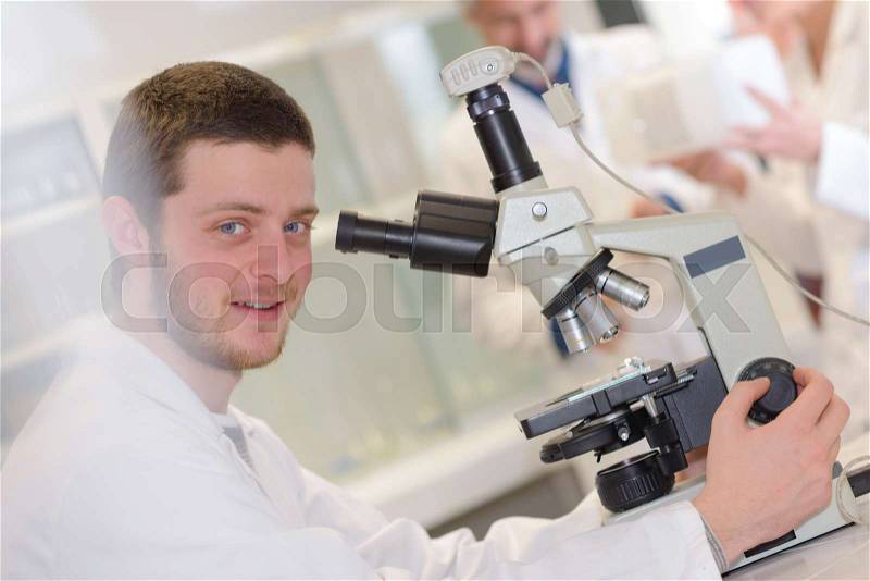 Science student working together in the lab at the university, stock photo