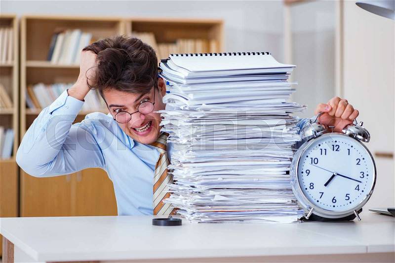 Businessman failing to meet report deadlines, stock photo