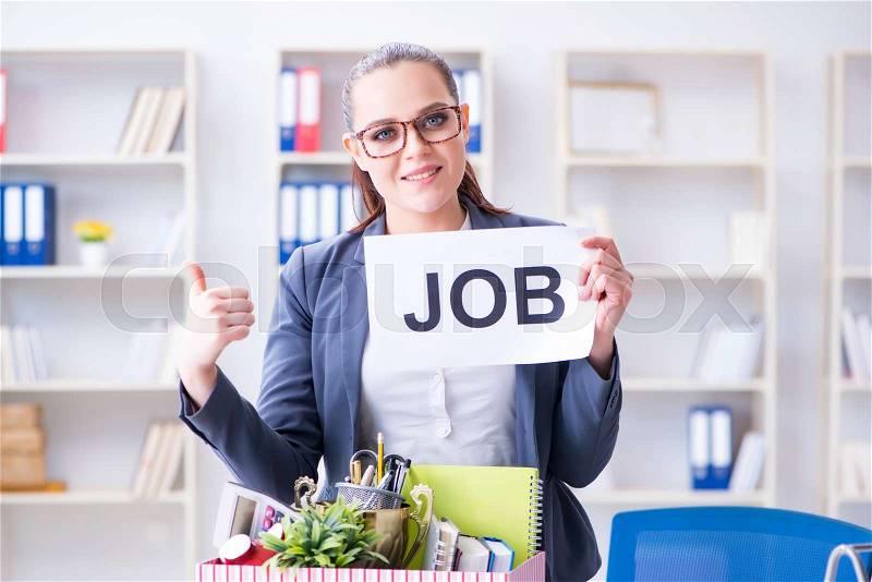 Businesswoman quitting her job in office, stock photo