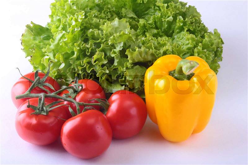 Fresh assorted vegetables bell pepper, tomato, garlic with leaf lettuce. Isolated on white background. Selective focus, stock photo