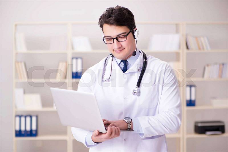 Young man doctor in medical concept, stock photo