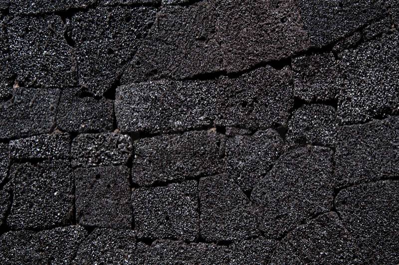 Wall made of typical arid volcanic stones in Lanzarote, Canary Islands, Spain, stock photo
