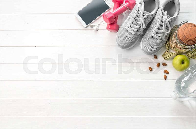 Fitness equipment and running shoes, diet food, additional space for text on side, stock photo