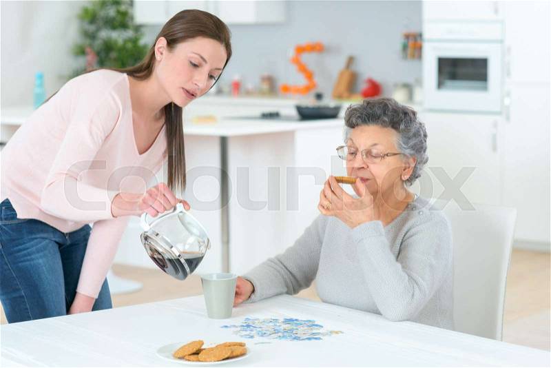 Senior woman with home help, stock photo