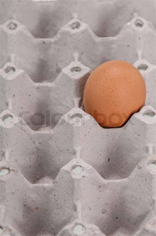 Close-up view of raw chicken eggs in egg box , stock photo