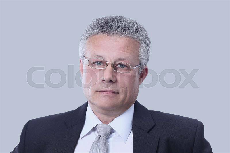 Gray-haired business man smiling isolated on gray background, stock photo